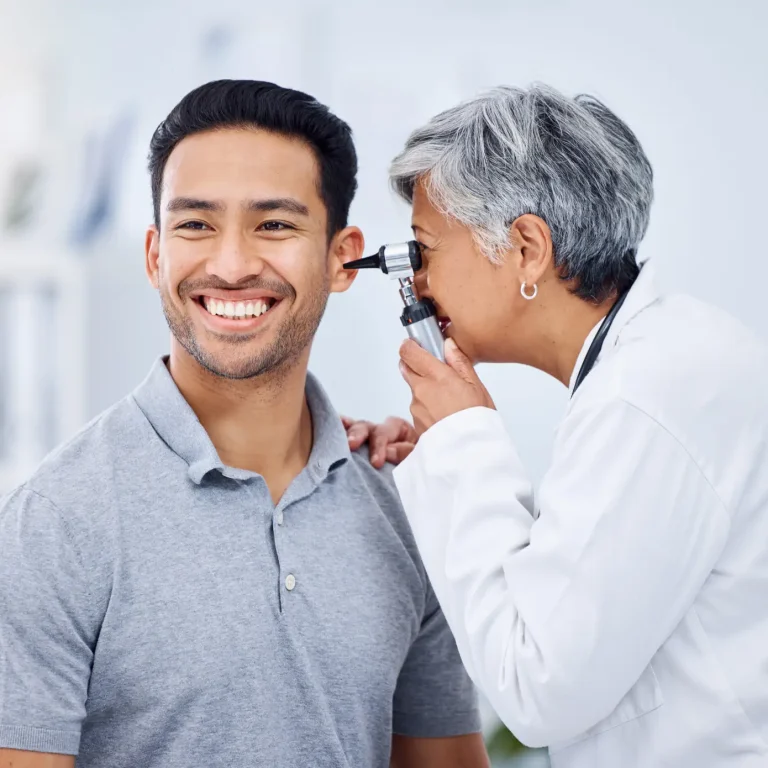 Doctor, patient or ear check for healthcare or wellness at hospital with otolaryngology specialist