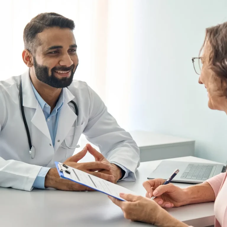 happy-indian-male-doctor-consulting-senior-patient-2026-01-08-00-19-39-utc